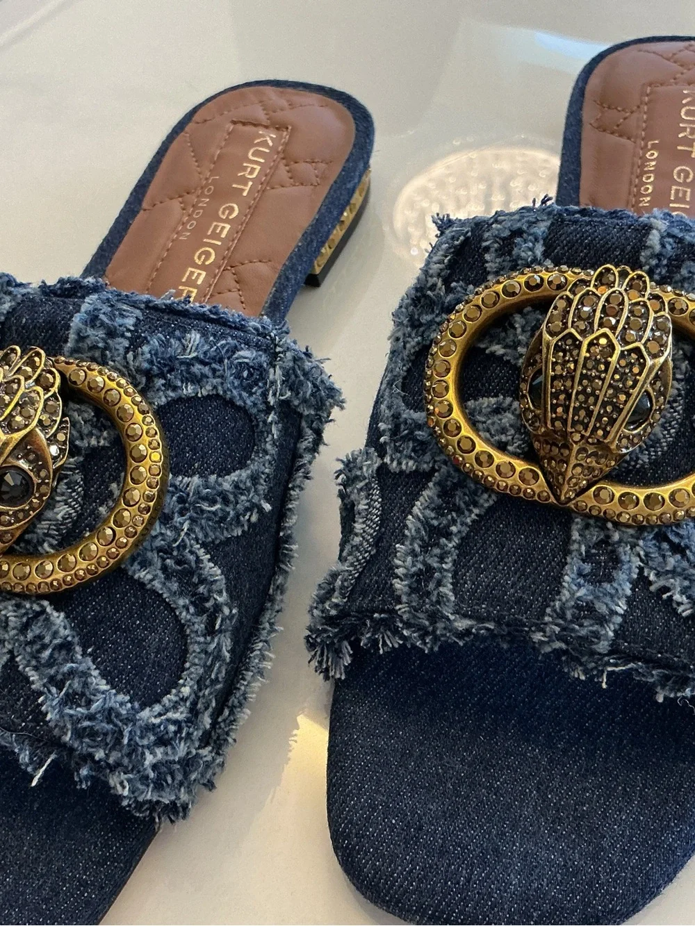 Kurt Geiger Distressed Denim Slide Mules with Gold Emblem